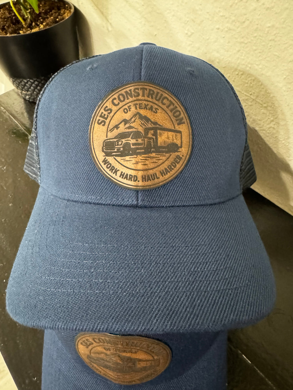 Navy Blue snap back trucker hat.