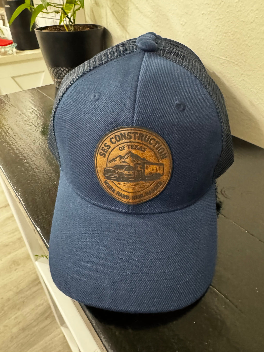 Navy Blue snap back trucker hat.